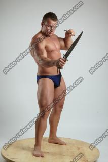 ADAM_WARD STANDING WITH TWO KNIVES